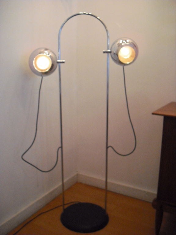 A rare 1960's chrome directional floor lamp by American designer, Robert Sonneman. The 