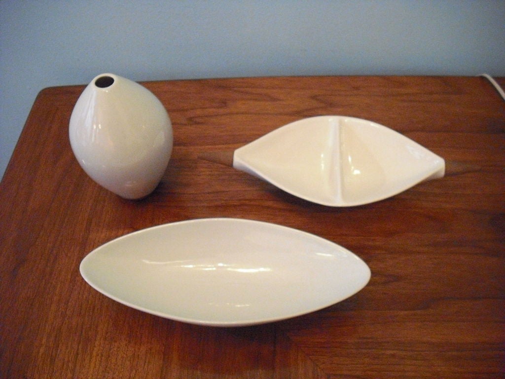 A 3 piece collection by New York industrial designer, Michael Lax.White ceramic with walnut accents.