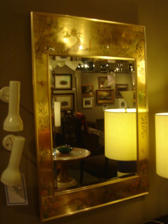 Asian-motif mirror by LaBarge.  USA, circa 1980.<br />
<br />
Features reverse-painted glass framed in brass.  A substantial mirror of quality and beauty.<br />
<br />
Signed by artist; dates to the 1980s.<br />
<br />
Measures overall xx