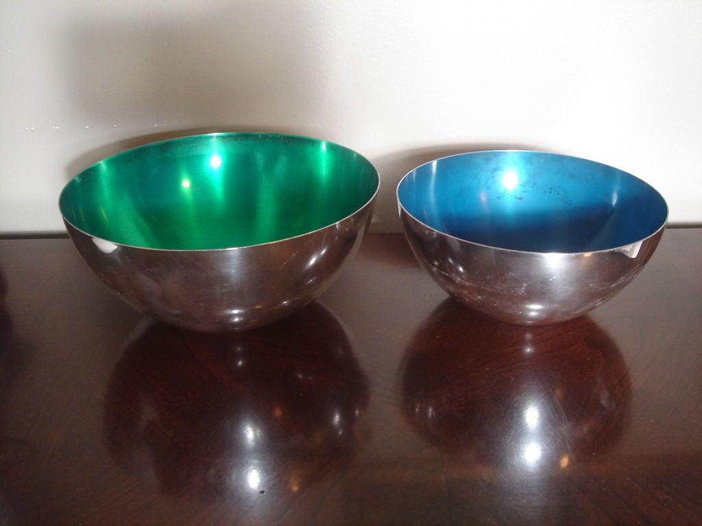 Pair of nickel-silver bowls with green and blue enamel, possibly by Cohr.  Denmark, circa 1960.<br />
<br />
Bowls feature electro-plated nickel silver exterior with enameled interiors; larger bowl has green enamel, while smaller bowl has blue