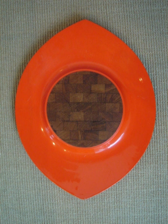 Orange lacquered wood serving tray inset with cutting board from the Festivaal collection by Dansk.  Denmark, circa 1960.