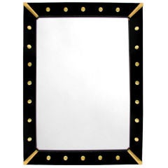 AMERICAN BLACK REVERSE-PAINTED GLASS MIRROR WITH BRASS CORNERS AMERICAN BLACK REVERSE-PAINTED GLASS MIRROR WITH BRASS CORNERS