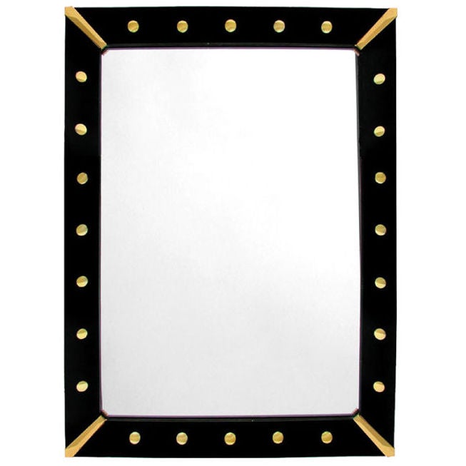 AMERICAN  BLACK REVERSE-PAINTED GLASS MIRROR WITH BRASS CORNERS For Sale