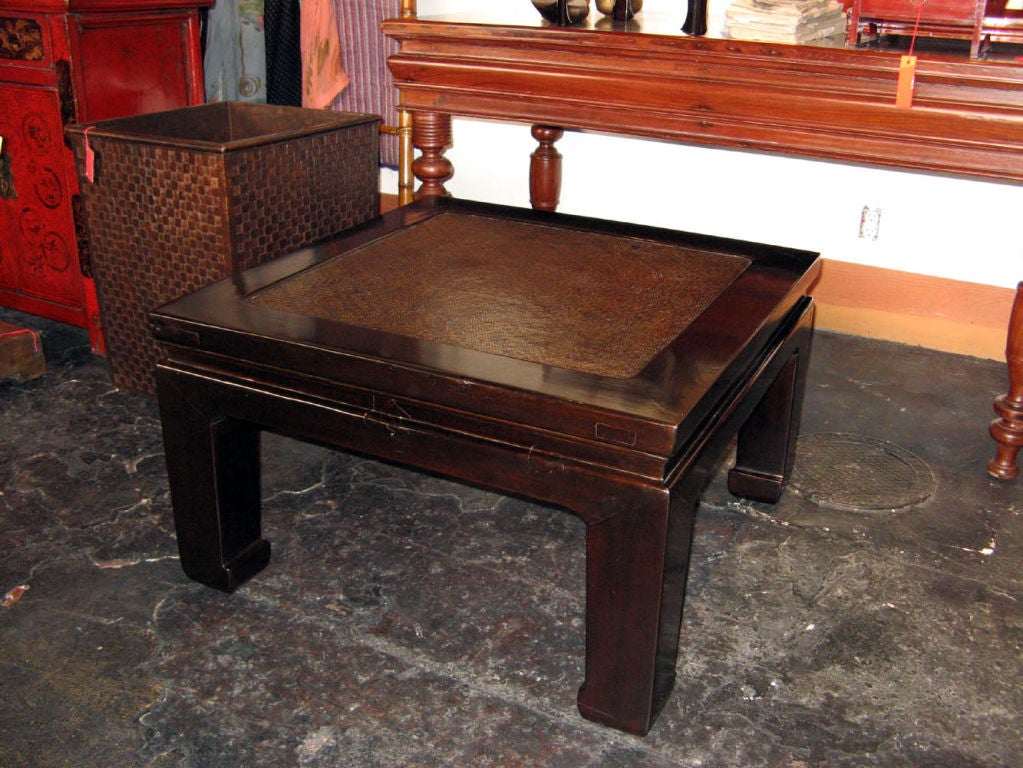 Contemporary Chinese rattan top elm wood coffee table. Finished in a wonderful, rich chocolate brown.