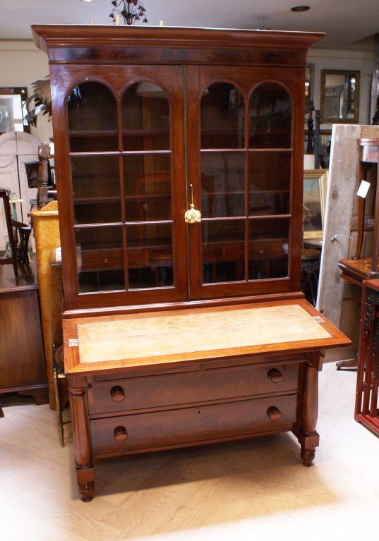 A nice small scaled American Empire period secretary chest  made during the first half of the 19th century.
