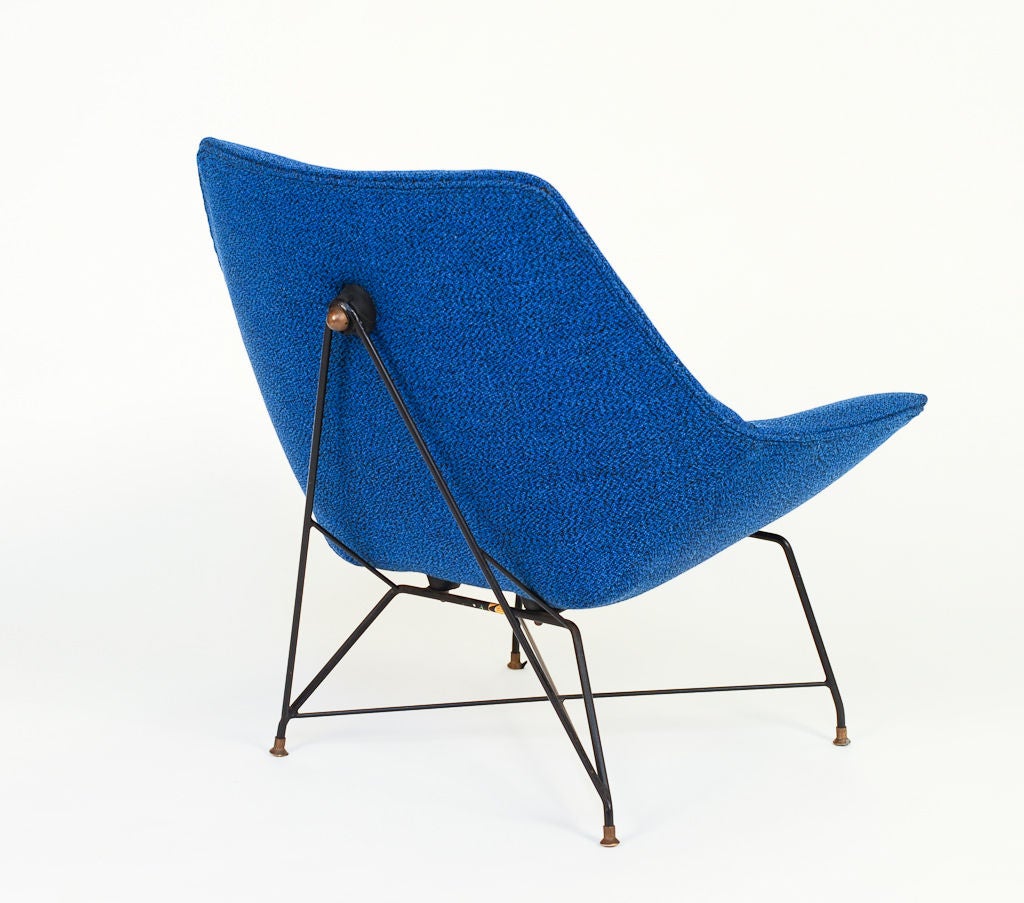 This Rare Kosmos chair is all original.  The frame work and rubber bumpers are in excellent condition.  The blue black wool fabric is factory fresh.  It is like the chair has been in a vault for the last 55 years.