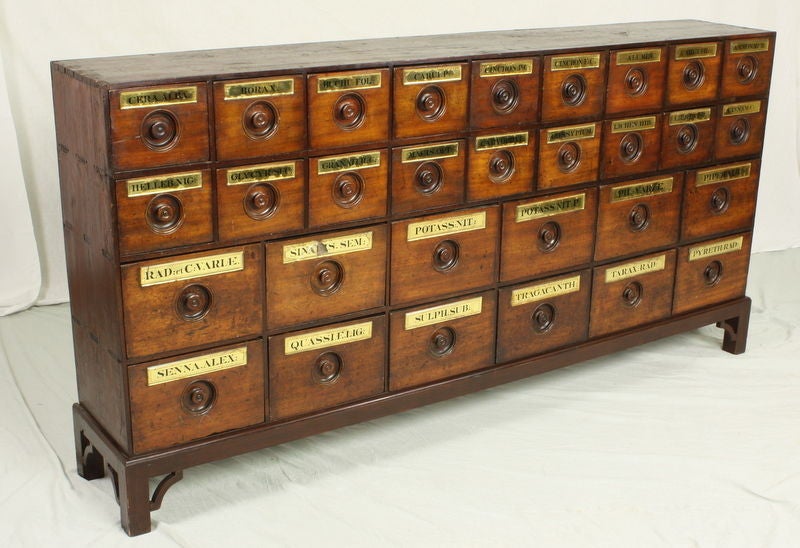 Very beautiful glow to the mahogany, this long chest will be dramatic on an important wall.  The best apothecary we have ever had! The labels are excellent and retain almost all of their gold leaf.  Drawers have elegant dovetailing.  The typical