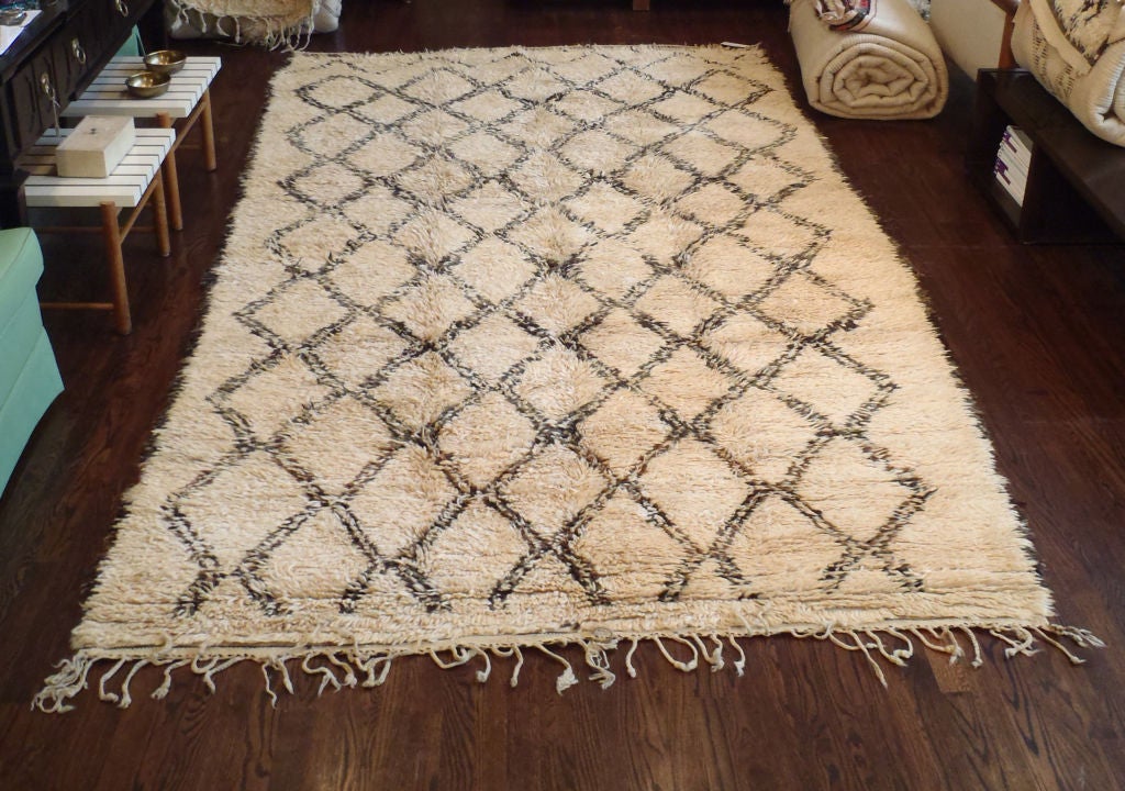 Hand-loomed, Deep pile wool rug with a natural ivory wool field and bold, geometric pattern in dark brown, fringed at one end. Others available - All on special sale from October 2nd through October 16th.