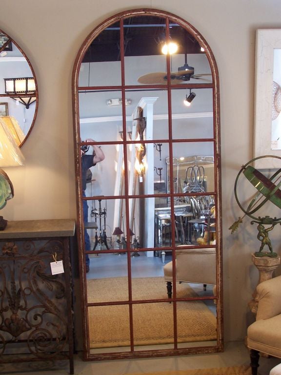 A pair of wrought iron industrial window frames fitted with mirror.  PRICE SHOWN BELOW IS FOR EACH MIRROR.