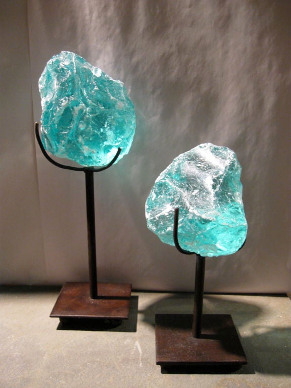Collection of three sculptural glass formations in various sizes, nestled in wrought iron stands. Aquamarine in color. <br />
NOTE: THERE ARE THREE IN COLLECTION.  TWO ADDITIONAL ONES ARE ALSO AVAILABLE.  CONTACT DEALER FOR PHOTOS.<br />
THESE ARE