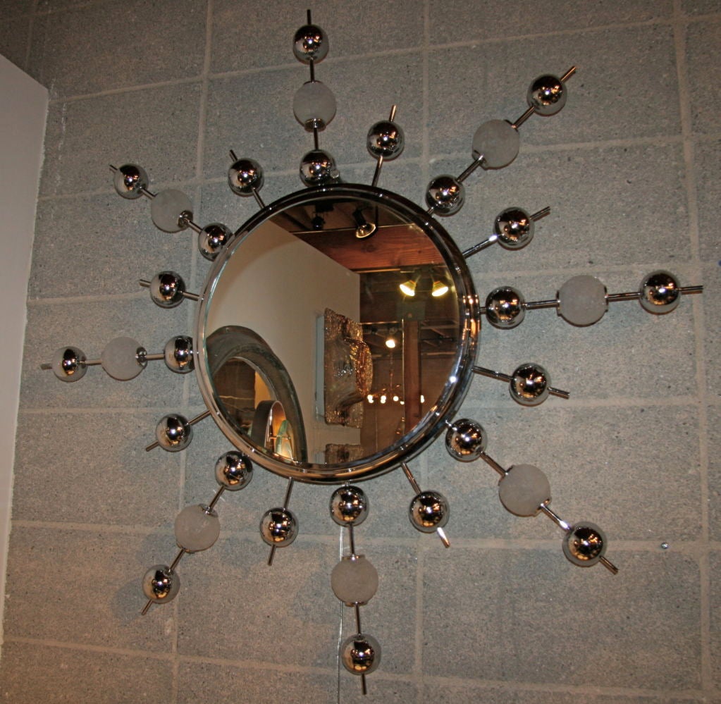 It's a sputnik mirror waiting to be hung and noticed anywhere!!!! in your humble abode, workplace, bedroom...