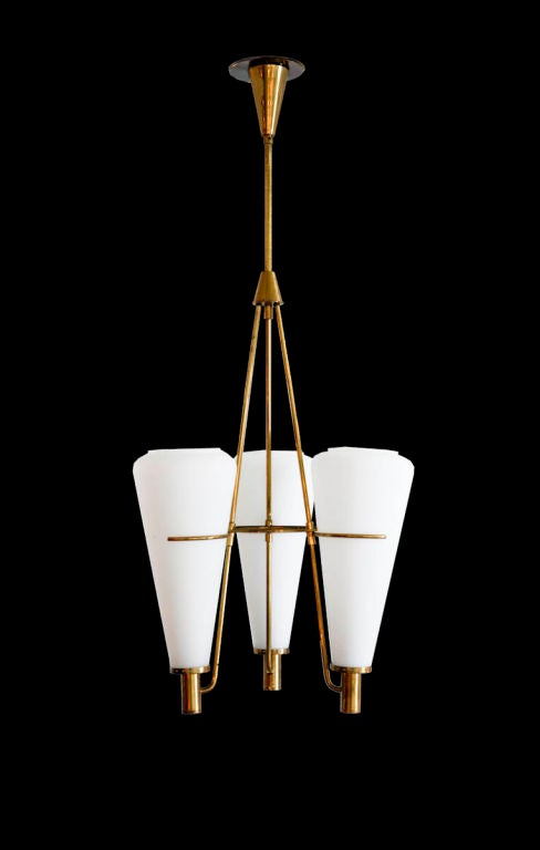 Three shade brass and satin glass chandelier designed by Stilnovo in Italy, circa 1950s. Wired for US junction boxes. Each shade takes one E27 60w maximum bulb.