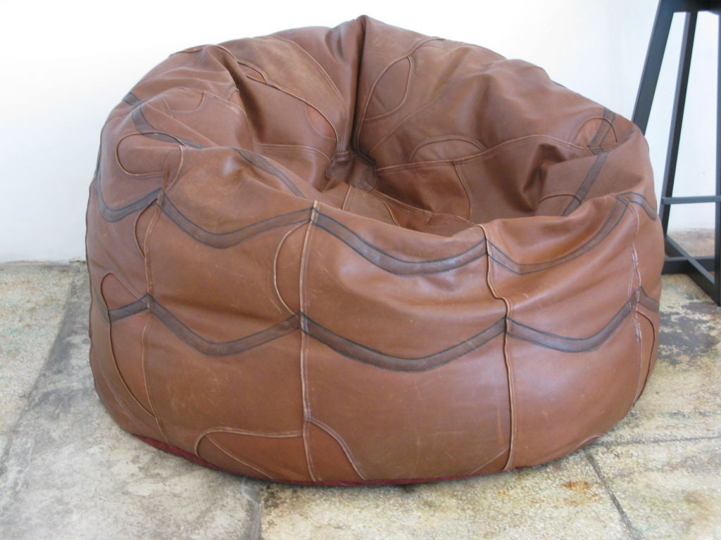 Original vintage oversized Brazilian leather bean bag with dark brown leather zig zag stitching.