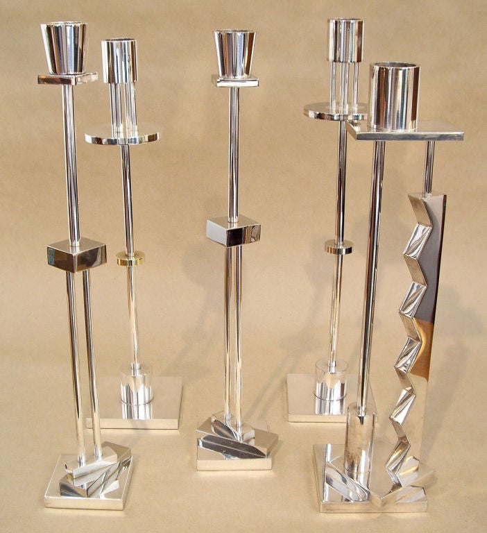 A group of five silver plated candlesticks designed by Italian designer Ettore Sottsass for Swid Powell. Signed E Sottsass- Swid Powell-silverplate-made in Italy. Price is for the group of five. Heights vary from 12.75 to 13.5
