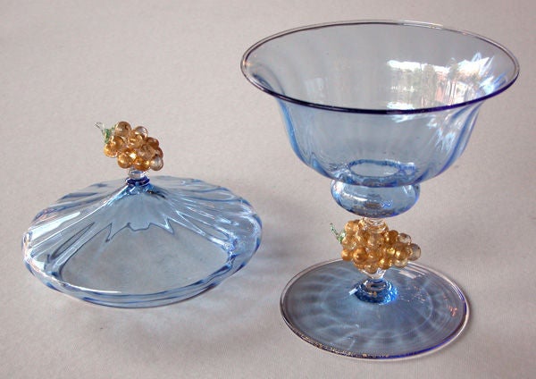 An elegant italian art deco periwinkle-glass covered compote with grape cluster accents; by Salviatti; the lobed compote with splayed lid and aventurine grape cluster finial; resting on a cup-shaped bowl over a grape cluster support above a circular