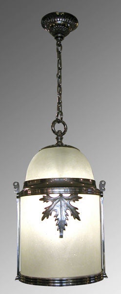 A handsome and good quality English Edwardian nickel-plated bronze cylindrical-form frosted glass lantern adorned with robust maple leaves; the frosted glass domed top above a cylindrical body fitted with slumped frosted glass above a hinged frosted