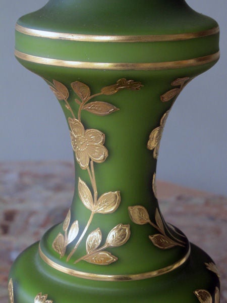 A Fine Pair of French Avocado Green Cased Glass Baluster-Form Oil Lamps with Gilt Floral Decoration
