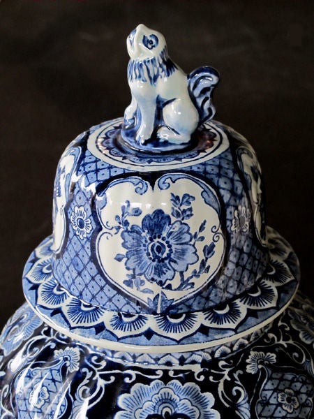 A robust pair of Dutch blue and white delftware covered ginger jars; marked: 