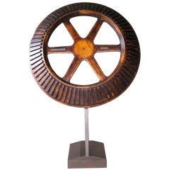 A Massive American Oak Industrial Gear Wheel Raised on Stand