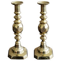 A Boldly-Scaled Pair of English Victorian Brass 'Beehive and Diamond' Pattern Candlesticks