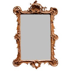 An Exuberant French Louis XV Style Carved Giltwood Mirror