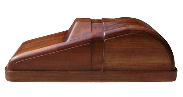 A charming American art deco solid mahogany car mold; the die in sold laminated mahogany for the manufacture of a child's toy pedal car (metal would be wrapped around this die and steering wheel attached later)