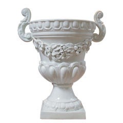 A Boldly-Scaled Spanish Baroque Style White-Glazed Campagna-Form Faience Urn