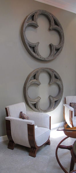 A massive Belgian neogothic gray painted quatrefoil window frame; can be fitted as a mirror; the hearldic frame of quatrfoil design with 4 lobed leaflets within a circular border