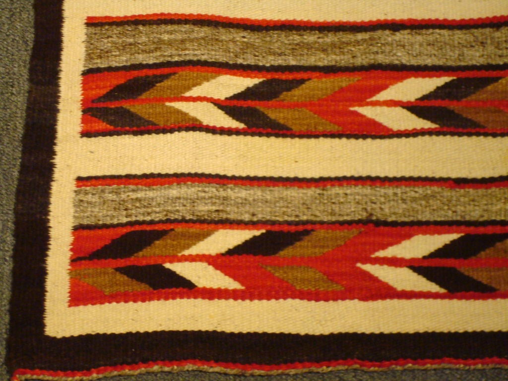 WONDERFUL GEOMETRIC INDIAN WEAVING RUG. THIS NAVAJO RUG IS IN GREAT CONDITION AND WONDERFUL COLORS W/ORIGINAL TIES IN CORNERS.