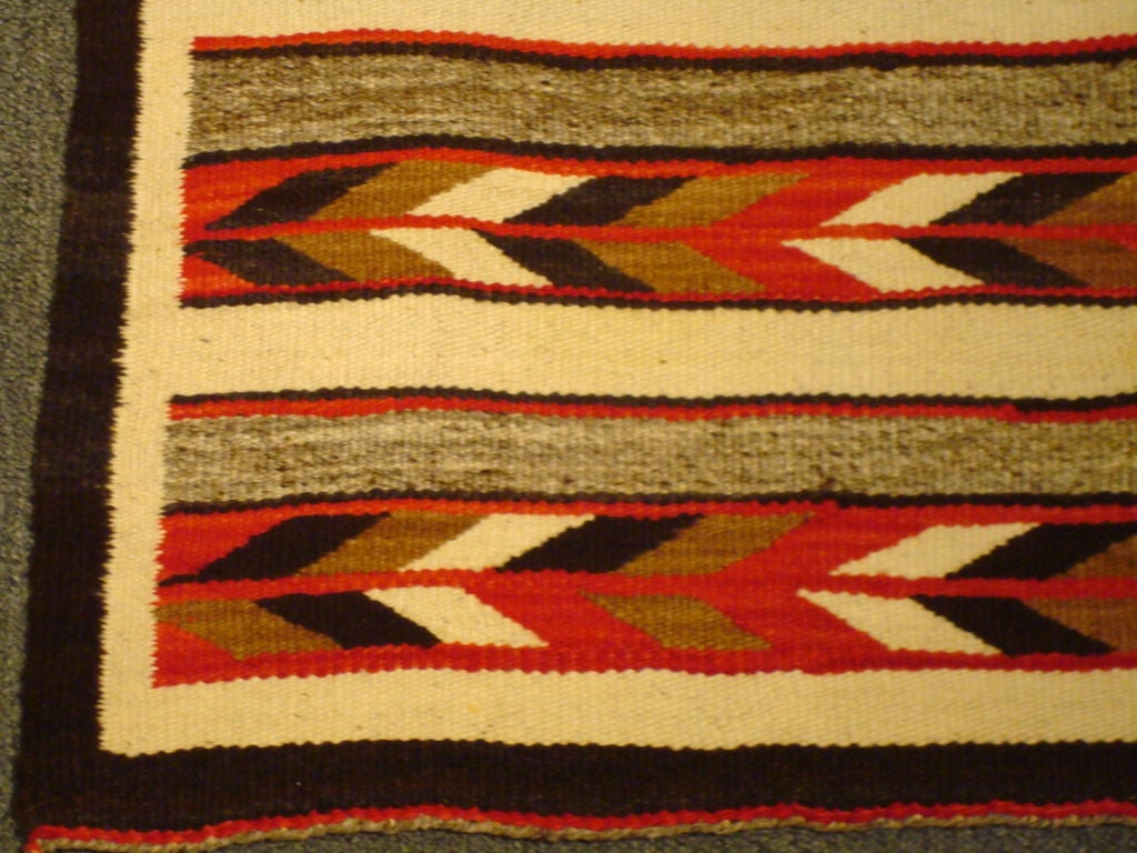 WONDERFUL GEOMETRIC INDIAN WEAVING RUG. THIS NAVAJO RUG IS IN GREAT CONDITION AND WONDERFUL COLORS W/ORIGINAL TIES IN CORNERS.