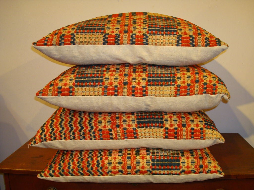 19TH C. COVERLET PILLOWS IN ORANGE, BLUE, AND BEIGE 1