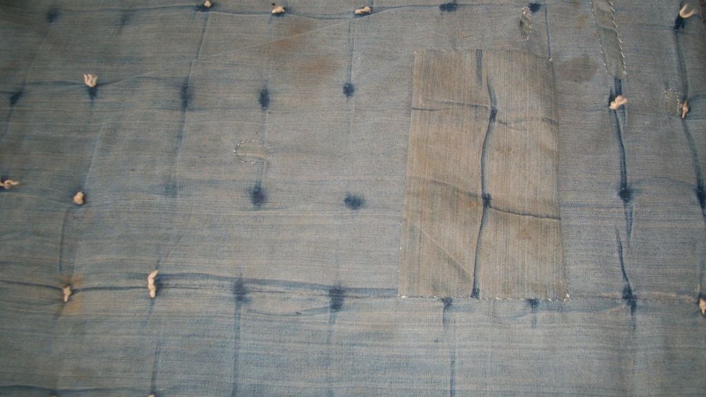 1930'S DENIM TIED COMFORTER REVERSIBLE QUILT FROM ALABAMA. THIS FOLKY QUILT HAS OLD TICKING AND DENIM REPAIRS THROUGH OUT. IT HAS MINOR STAINING AND IS ON THE THICKER SIDE. CONDITION IS GOOD OTHER WISE.
