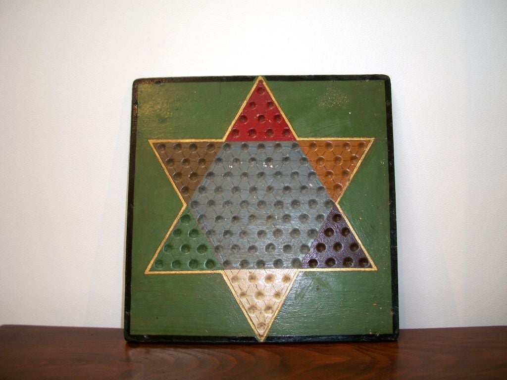FANTASTIC SEVEN COLORS 19THC REVERSABLE GAME BOARD.THE TOP SIDE IS THE STAR CHINESE CHECKERS AND THE REVERSE IS BROWN AND WHITE CHECKER BOARD.THE CHECKER BOARD SIDE HAS A FRAMED MOLDING TRIM.