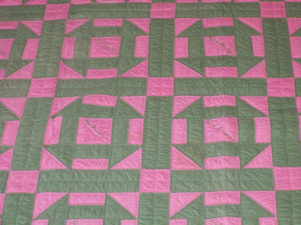 This pink and green signed and dated 1929 pastel friendship quilt is from Ohio. The condition is good and every block has a signature.