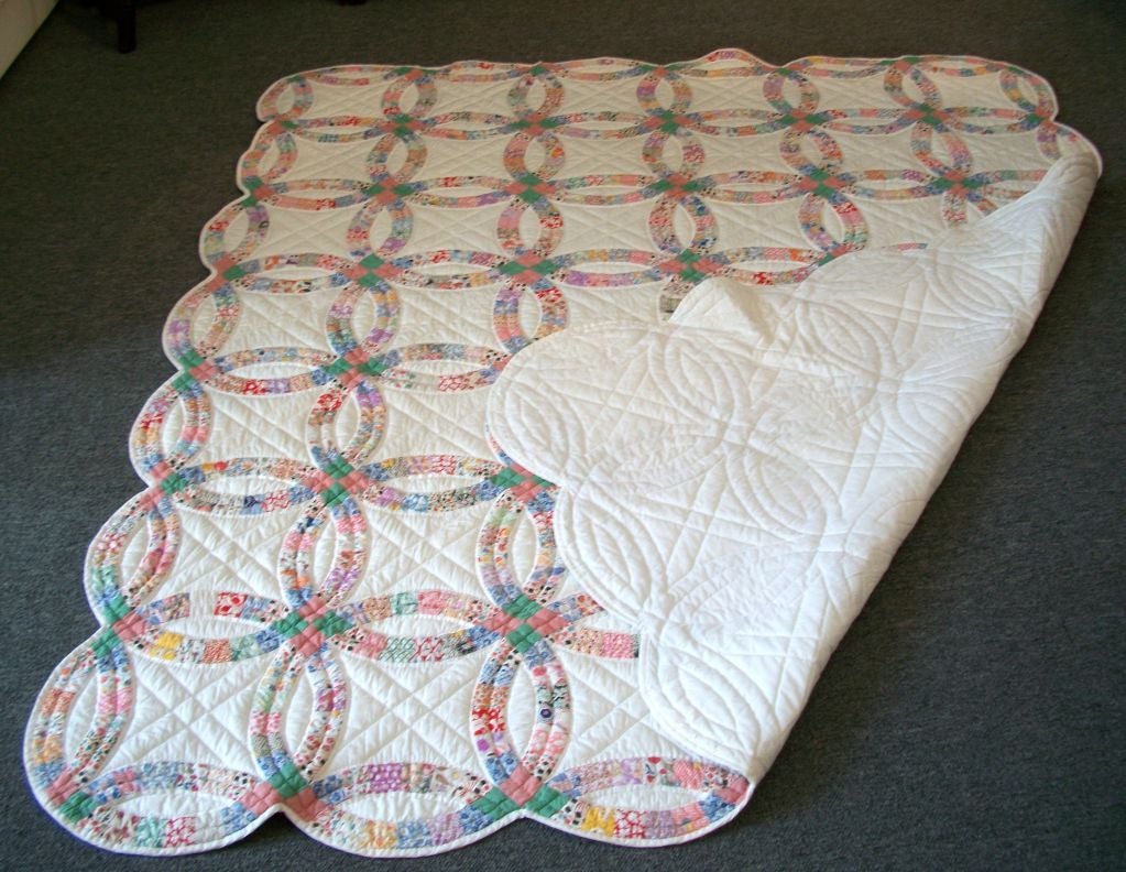 This Double Wedding Ring Quilt Is Very Well Executed. It Is Very Hard to Find These Quilt In Such Great Condition and Large In Size. This Would fit a Queen Or King Bed.