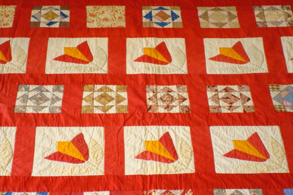THIS FOLKY SAMPLER QUILT HAS MANY DIFFERENT BLOCKS OR SQUARES OF DIFFERENT FABRIC. THE QUILT IS FROM PENNSYLVANIA AND CONDITION IS GOOD. THE BACK ROUND FABRIC IS TURKEY RED SASHING.