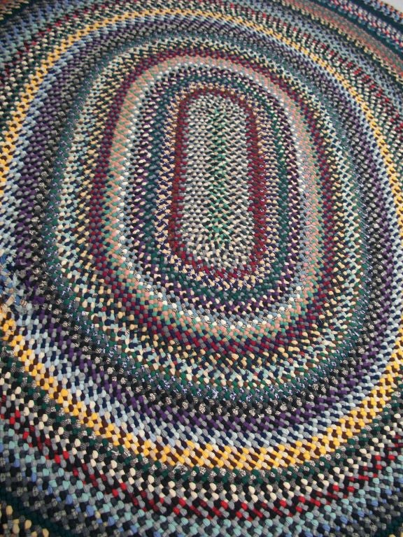 20TH C. LARGE OVAL BRAIDED RUG/WOOL AND MULTI COLORED