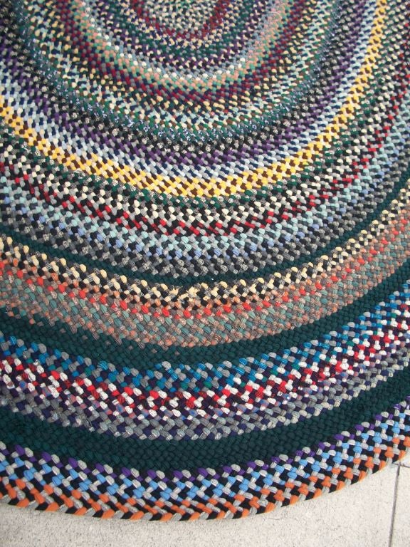 20TH C. LARGE OVAL BRAIDED RUG/WOOL AND MULTI COLORED at 1stdibs