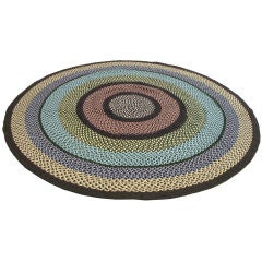 EARLY 20TH C. ROUND MULTI-COLORED BRAIDED WOOL RUG