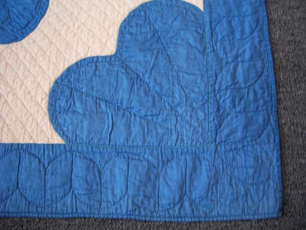 1930'S SKY BLUE AND CREAM SATEEN APPLIQUE QUILT WITH NICE QUILTING AND GOOD CONDITION. THIS QUILT IS FROM PENNSYLVANIA.