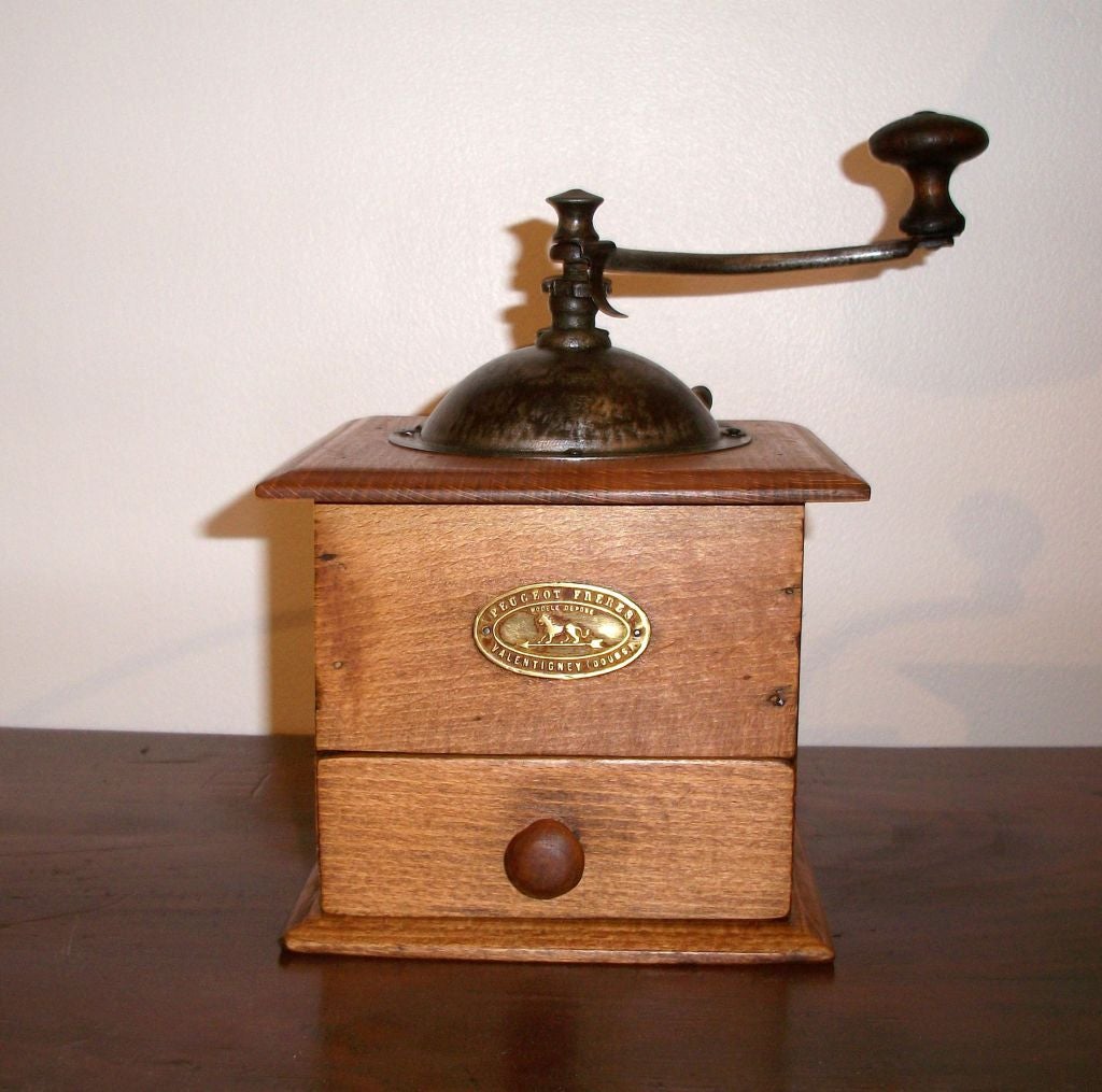 19TH C. WOODEN COFFEE GRINDER WITH METAL TOP. SIGNED PEUGEOT FRERES VALENTIGNEY (DOUBS)