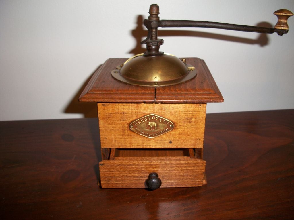 19TH C. WOODEN COFFEE GRINDER WITH IRON, WOOD AND BRASS HANDLE. SIGNED PEUGEOT & CIE PONT-DE-ROIDE (DOUBS)