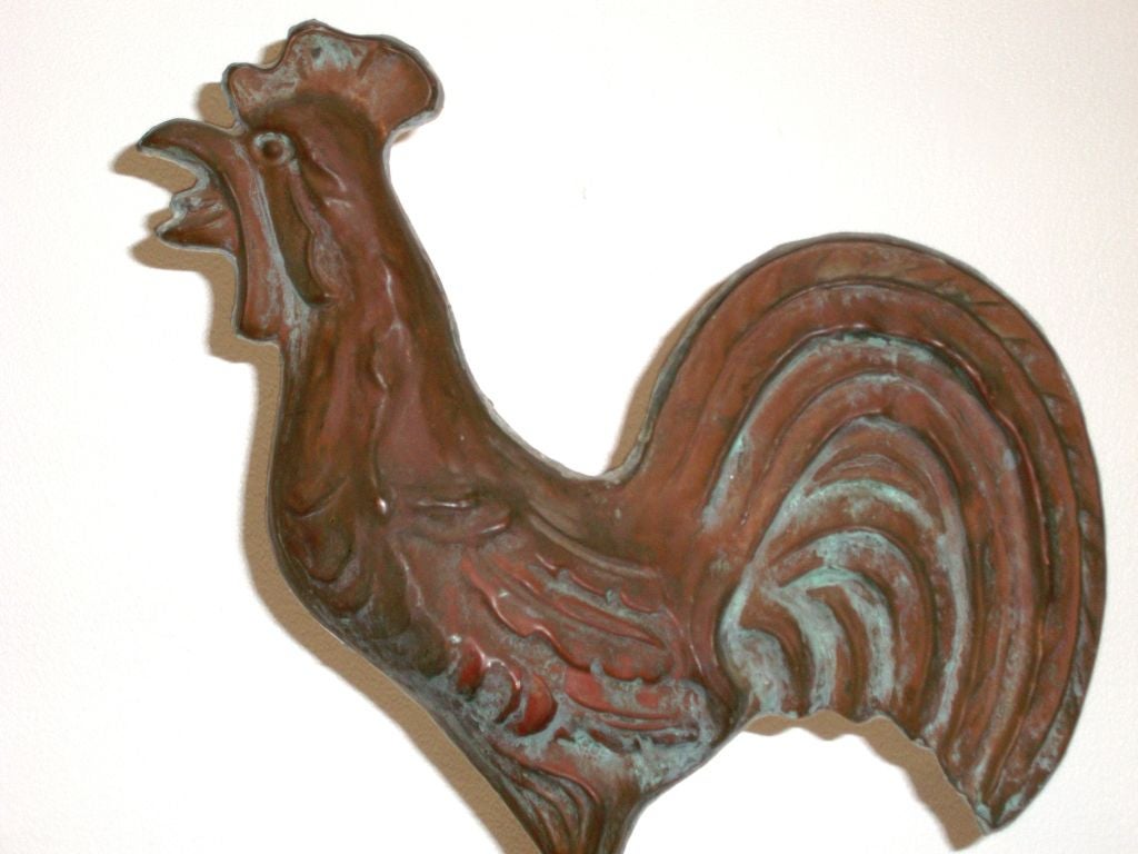 19TH C. AMERICAN COPPER FULL BODY ROOSTER WEATHERVANE. WONDERFUL FOLKY FORM  AND NICE PATINA. THIS IS ON A CUSTOM  CAST IRON MOUNT. (THE ROOSTER HAS BEEN REMOUNTED ON A CENTER MOUNT)THE SURFACE IS OXIDISED COPPER AND THE SIZE IS QUITE UNUSUAL. THIS
