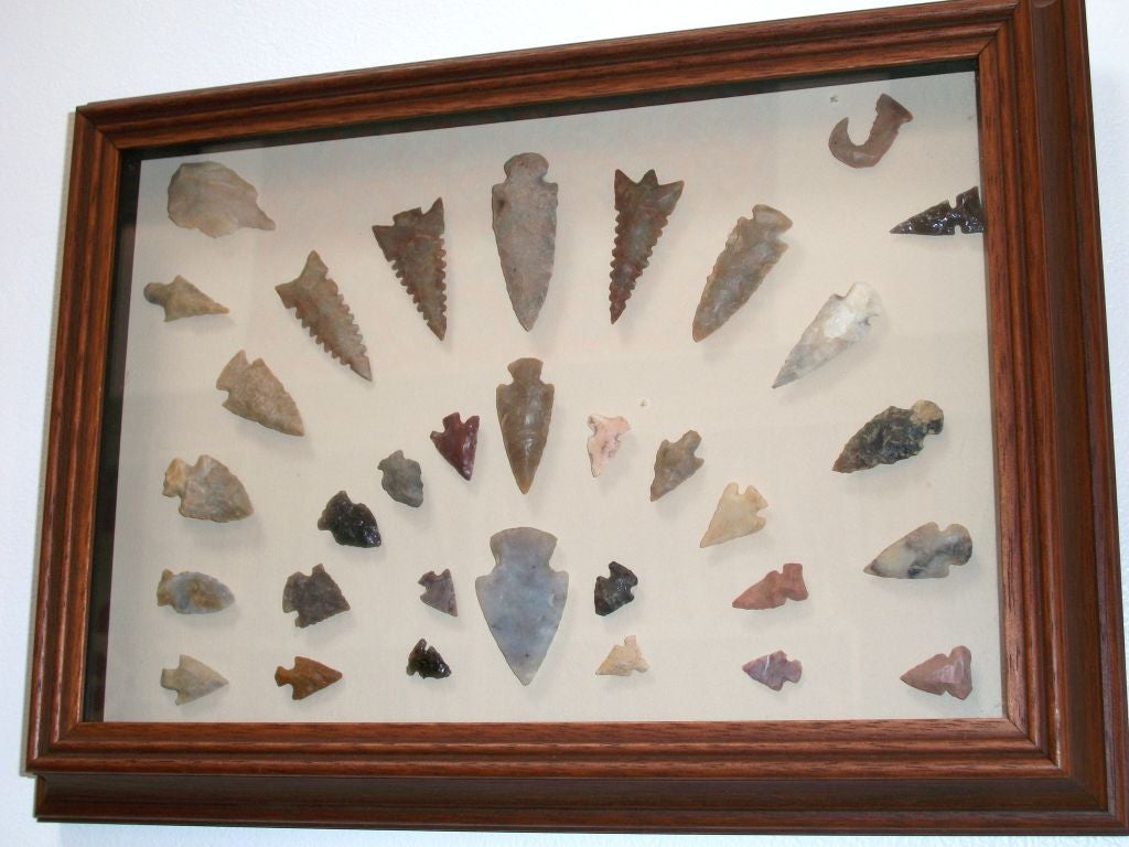 COLLECTION OF AMERICAN INDIAN HAND MADE 19THC ARROWHEADS. THIS WONDERFUL GROUP ARE ALL IN A FRAME AND SOLD AS ONE. FROM A PRIVATE COLLECTION IN THE MID WEST.
