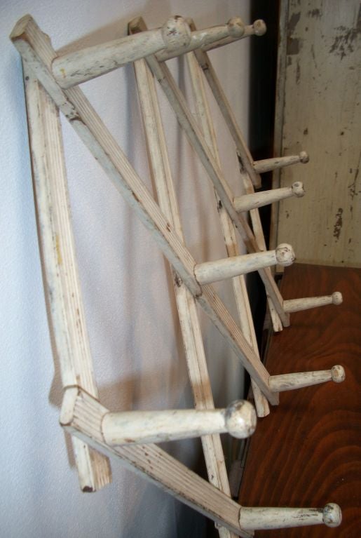 19TH C. ORIGINAL WHITE PAINTED ACCORDION STYLE, WOOD CUP RACK