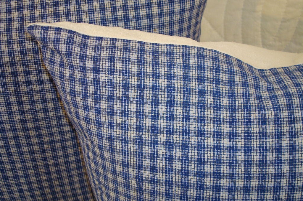 Linen plaid pillows in blue and white. Backing is white homespun linen. Zipper on bottom and down and feather inserts.
  