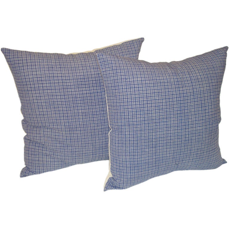 19TH C. LINEN PLAID PILLOWS IN BLUE AND WHITE.
