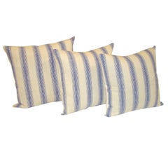 19TH C. LINEN STRIPED PILLOWS IN BLUE, AND WHITE.