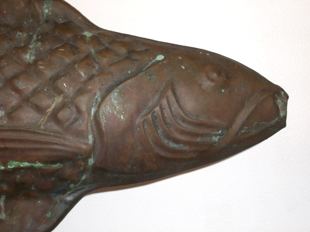THIS EARLY NEW ENGLAND COPPER FISH WEATHERVANE IS IN GREAT CONDITION AND HAS WONDERFUL PATINA. IT IS ON A PROFESSIONAL CUSTOM MADE CAST IRON STAND. THIS VANE COMES FROM A PRIVATE COLLECTION FROM MAINE. A GREAT ADDITION TO ANY FOLK ART COLLECTION.