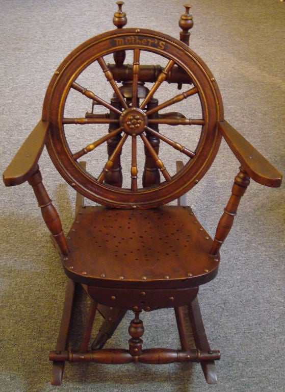 RARE ROCKING CHAIR MADE FROM A EARLY 19THC SPINNING WHEEL FROM NEW ENGLAND. ORIGINAL OLD FINISH WITH 